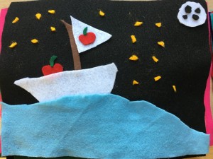 A 3rd grader's felt collage of an apple boat.